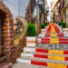 narrow alley decorated with flag spain steps calpe alicante