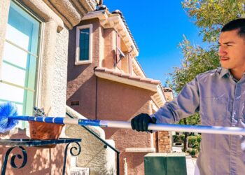 Man cleaning a window