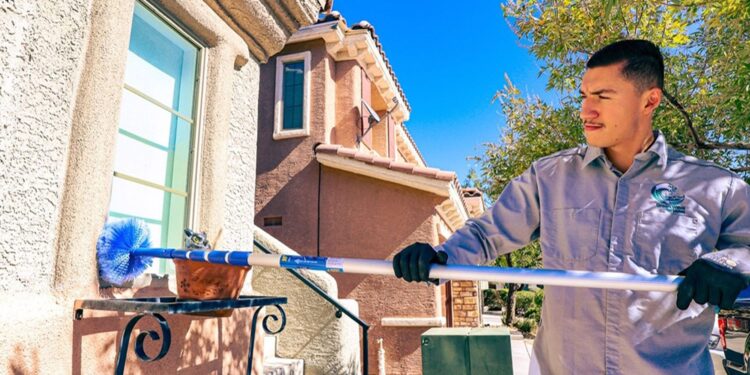 Man cleaning a window