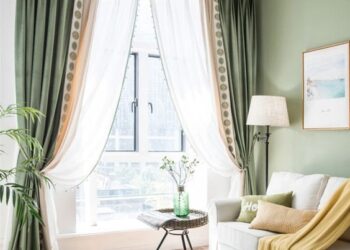 green wall with white green curtain