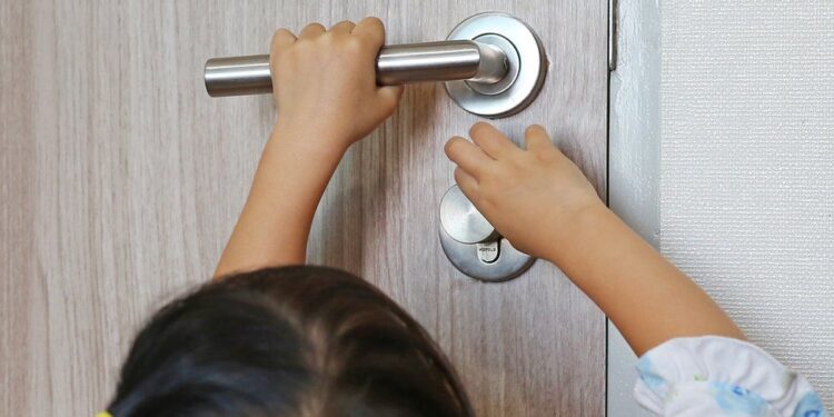 children unlock a door
