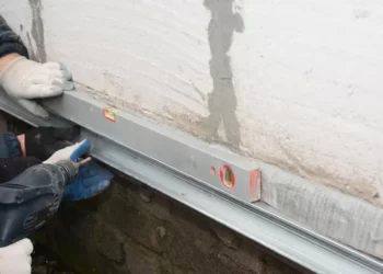 A person repairing the foundation