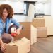 Girl taping a box