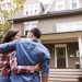 Couple Standing in front of house