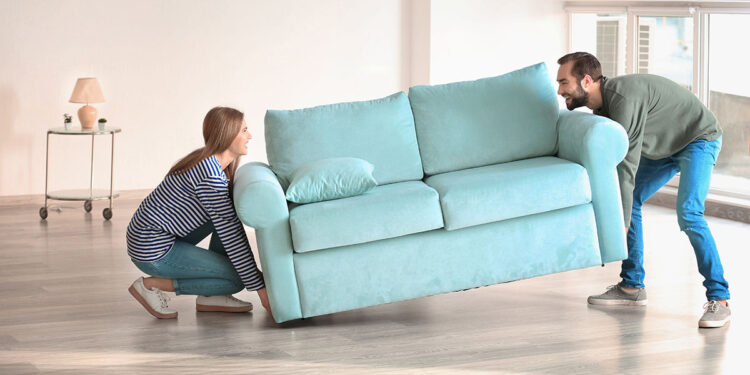 Couple arranging Furniture