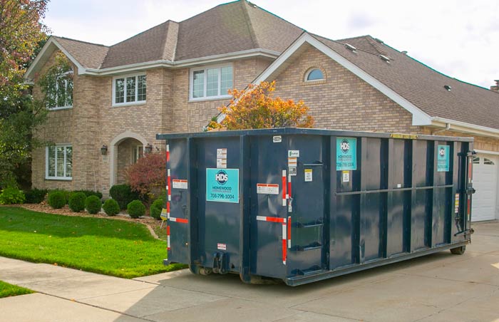 Cheapest Dumpster Rental filled with garbage