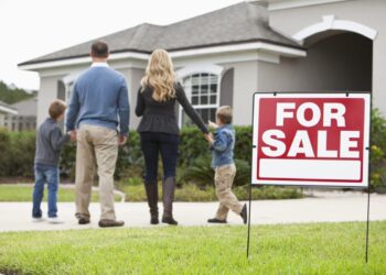 Family standing in front of the house