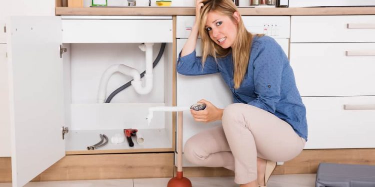 Girl Fixing Plumbing issue