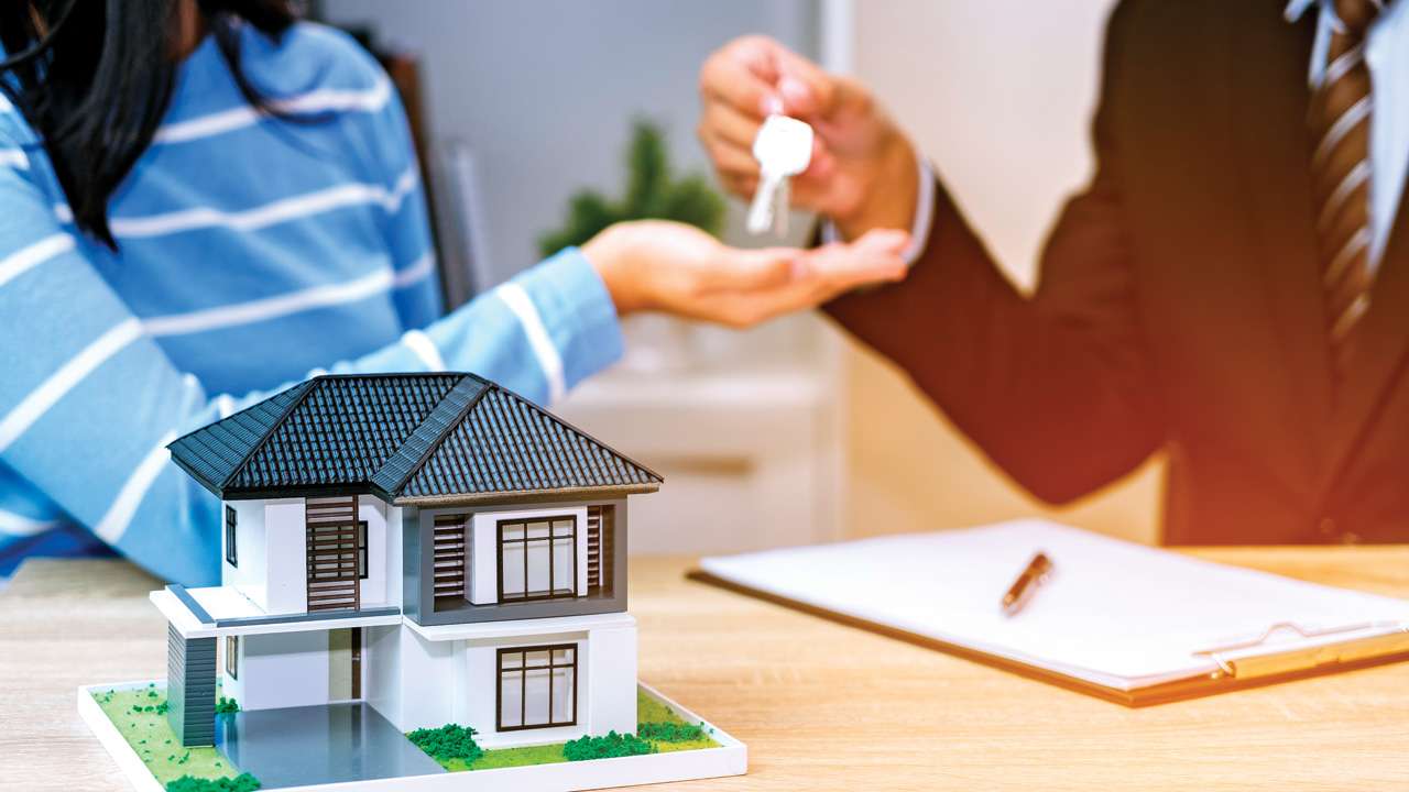 Girl taking keys of her new house