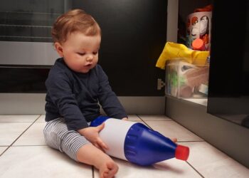 Kid playing with Safety Hazards at Home