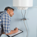Plumber Checking water heater