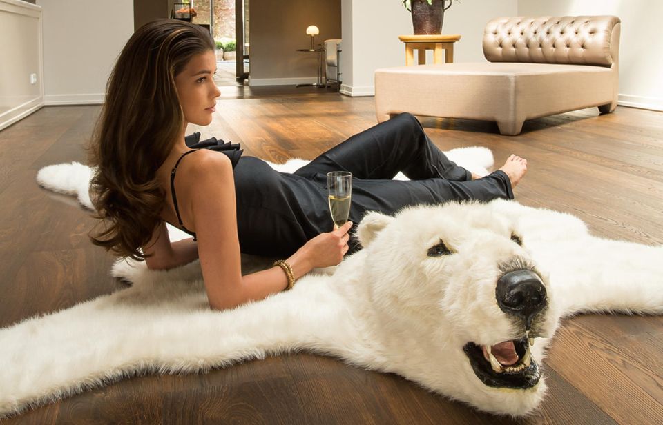 The classic white polar bear rugs for beige couch