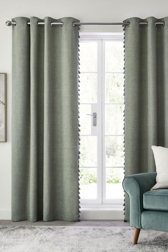 Pale olive wall with pale curtain
