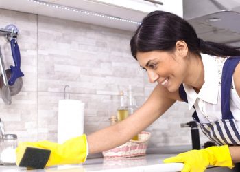 girl cleaning kitchen