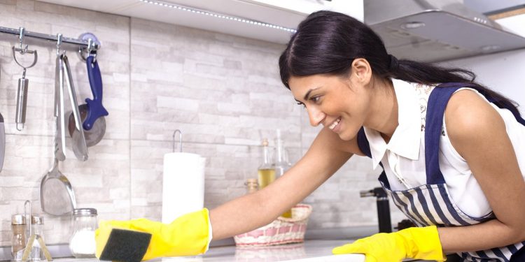 girl cleaning kitchen