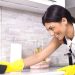 girl cleaning kitchen