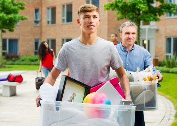 boy moving house with his parent
