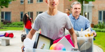 boy moving house with his parent