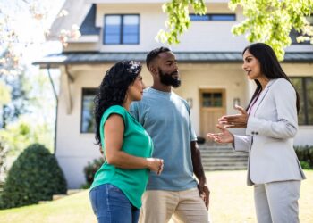 couple talking to a realtor
