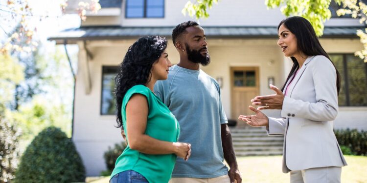 couple talking to a realtor