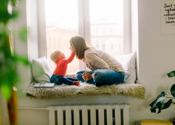 lady playing indoor with her kid
