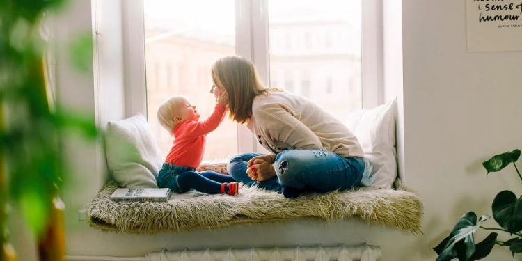 lady playing indoor with her kid