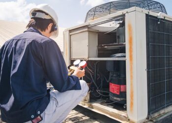 technician checking ac unit