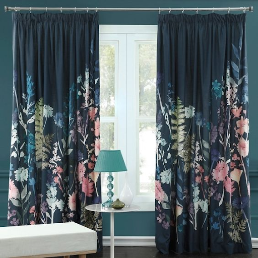 flower design curtains with green walls