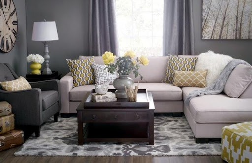 living room with gray walls and light gray carpet