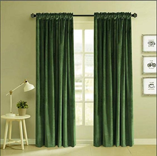 Dark green curtain with light hue wall
