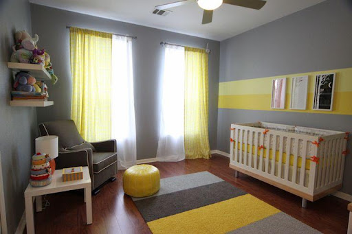 room with gray walls and yellow carpet