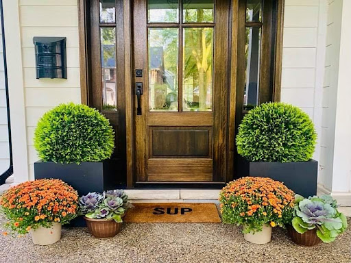decorate your front door with artificial topiary balls