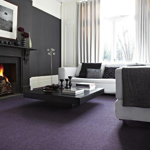 room with gray walls and purple carpet